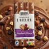 Nestle chocolate bar with hazelnuts and raisins on a wooden surface